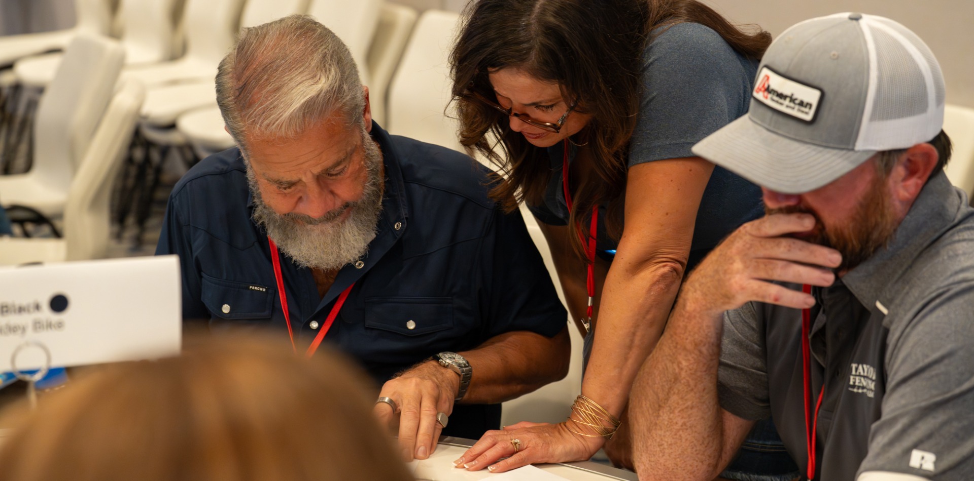AFA committee members reviewing a document at the AFA 2025 Mid Year meeting.